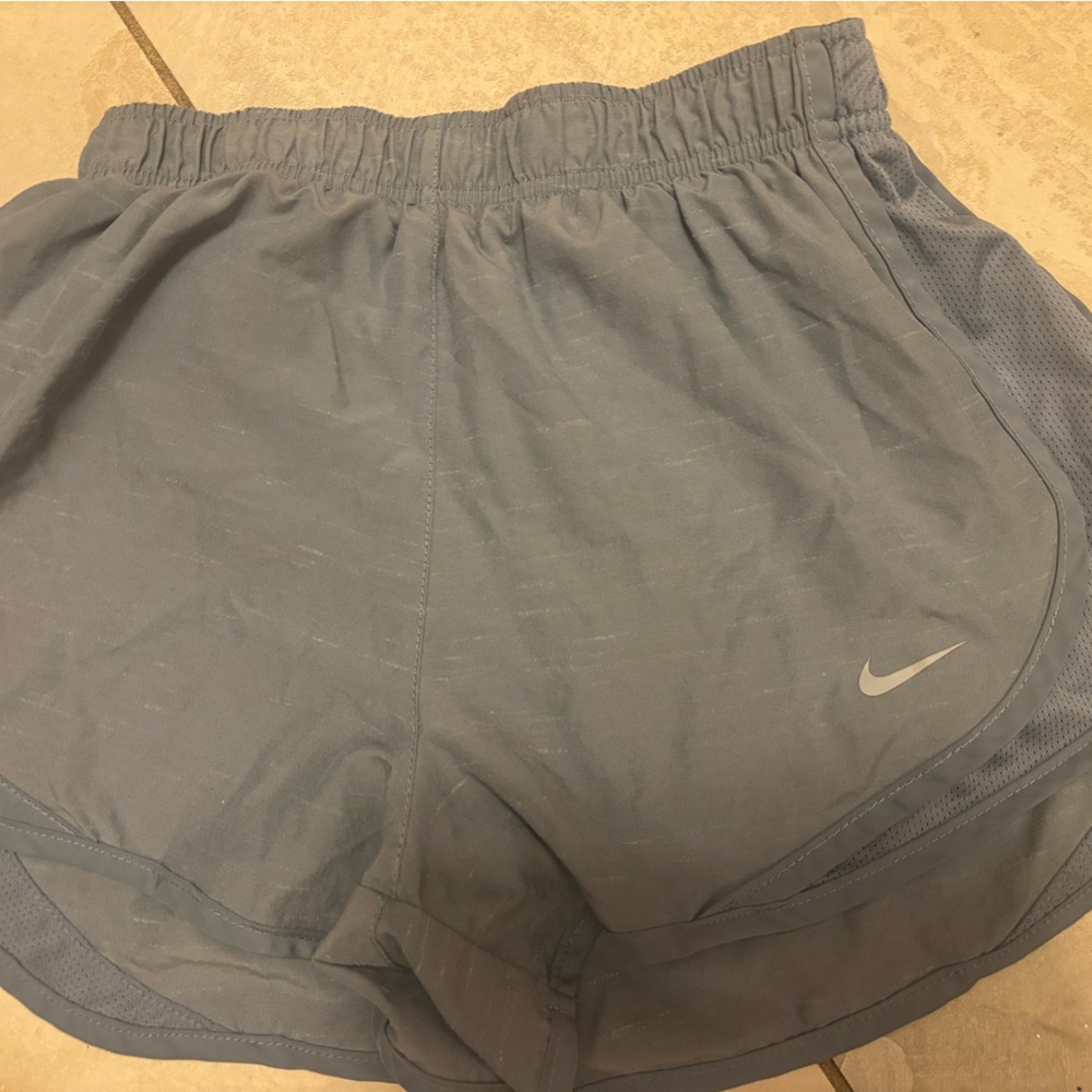 Small grayish Nike DriFit shorts